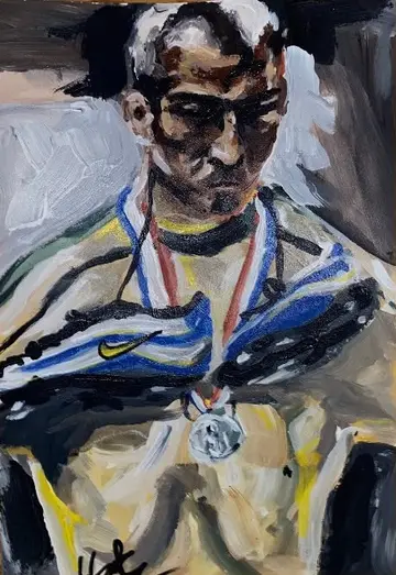 Porträt eines Sportlers mit Medaille um den Hals, Trikot in Gelb und Blau.
